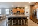Well-designed kitchen with a large island, granite counters, and stainless-steel appliances at 37236 N Navarra Rd, San Tan Valley, AZ 85140
