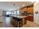Modern kitchen featuring a granite island, stainless steel appliances, and open layout concept at 37236 N Navarra Rd, San Tan Valley, AZ 85140