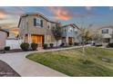 Charming two-story home with neutral siding, manicured lawn, sidewalk, and inviting front yard at 3802 E Stiles Ln, Gilbert, AZ 85295
