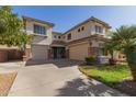 Charming two-story home with a three-car garage and well-manicured landscaping at 502 E Kona Dr, Casa Grande, AZ 85122