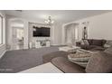 Comfortable living area with a large sectional sofa and stylish decor at 502 E Kona Dr, Casa Grande, AZ 85122