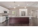 Bright kitchen featuring a center island, stainless steel appliances, and ample counter space at 520 W Townley Ave, Phoenix, AZ 85021