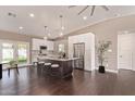 Open concept kitchen with stainless steel appliances, a large island, and modern white cabinetry at 520 W Townley Ave, Phoenix, AZ 85021
