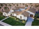 Expansive home featuring a tile roof, a well-kept lawn and desert landscaping, and a private driveway at 6621 E Doubletree Ranch Rd, Paradise Valley, AZ 85253