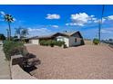 Well-maintained home with desert landscaping for low maintenance and attractive curb appeal at 7102 W Wilshire Dr, Phoenix, AZ 85035