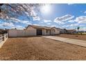 Inviting single-story home with a private driveway, attached garage and minimal, xeriscape landscaping at 7407 W Hatcher Rd, Peoria, AZ 85345