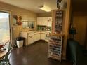 Bright kitchen with white cabinets, wood floors, and stainless steel appliances at 8929 E Bramble Ave, Mesa, AZ 85208