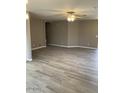 Living room featuring neutral paint and wood floors at 8929 E Bramble Ave, Mesa, AZ 85208