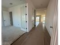 Bright entryway featuring tile flooring, white walls, and doors creating a welcoming atmosphere at 11447 E Utah Ave, Mesa, AZ 85212