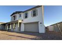 Stylish two-story home with a two-car garage and well-designed exterior, capturing a modern aesthetic at 11447 E Utah Ave, Mesa, AZ 85212