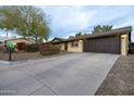 View of the driveway leading up to the home's two-car garage at 14407 N 35Th Pl, Phoenix, AZ 85032