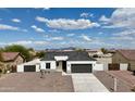 Beautiful aerial view of a single story home with a gray roof and desert landscaping at 15901 S Saxon Rd, Arizona City, AZ 85123