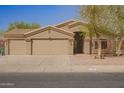 Charming single-story home with three-car garage, desert landscaping and neutral paint at 1756 E Cardinal Dr, Casa Grande, AZ 85122