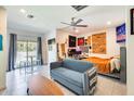 Open-concept room featuring tile flooring, a modern ceiling fan and large window at 2228 W Harmont Dr, Phoenix, AZ 85021