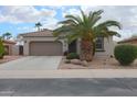 Charming single-story home with a well-maintained front yard, desert landscaping, and a two-car garage at 2509 E Dulcinea Trl, Casa Grande, AZ 85194