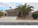 Charming single-story home with a well-maintained front yard, desert landscaping, and a two-car garage at 2509 E Dulcinea Trl, Casa Grande, AZ 85194