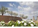 Inviting entrance sign for Anthem at Del Webb, surrounded by lush landscaping and white flowers at 2638 N Coronado Dr, Florence, AZ 85132