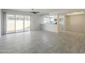 Bright and airy living room flows seamlessly to the outdoor patio through sliding glass doors and open to the kitchen at 838 W Duke Dr, Tempe, AZ 85283