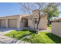 Lovely single-story home showcasing a desert landscape, a garage, and a covered entrance at 1021 S Greenfield Rd # 1213, Mesa, AZ 85206