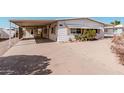Well-maintained home featuring a spacious carport and low-maintenance landscaping at 106 S 74Th St, Mesa, AZ 85208