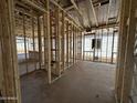 Interior view showcasing the framing and plumbing of a new home, emphasizing the construction phase at 11426 E Utopia Ave, Mesa, AZ 85212