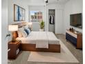 Serene bedroom featuring a comfortable bed, stylish furnishings, and ample natural light at 11734 W Paradise Dr, El Mirage, AZ 85335