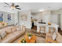 Inviting living room with modern decor, including a stylish sofa and wooden accents at 1420 E Sonrisas St, Phoenix, AZ 85040