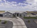 An aerial shot of home with horseshoe driveway and well manicured grounds at 1455 E Dove Pl, Casa Grande, AZ 85122