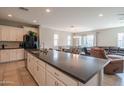 Open kitchen with a large island and seamless connection to the dining and living area at 18187 W Via Montoya Dr, Surprise, AZ 85387