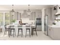Spacious kitchen with stainless steel appliances, modern cabinetry, and a center island with seating at 2370 W Los Arboles Pl, Chandler, AZ 85224