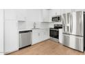 Well-lit kitchen features stainless steel appliances and white cabinetry at 2828 W Eagle Talon Rd, Phoenix, AZ 85085