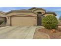 Well-maintained single-story home featuring a two-car garage at 42266 W Sparks Dr, Maricopa, AZ 85138