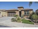 Charming single-story home with desert landscaping, a two-car garage, and a tile roof at 830 E Garden Basket Dr, Queen Creek, AZ 85140