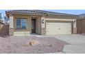 Attractive single-story home with desert landscaping, a two-car garage, and a welcoming entrance at 11522 W Deanne Dr, Youngtown, AZ 85363