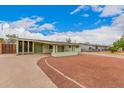 Attractive home with a long driveway and landscaped yard providing great curb appeal at 1238 E Barcelona Ave, Casa Grande, AZ 85122