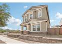Beautifully constructed two-story home with decorative stone and light-colored stucco, plus manicured landscaping at 1978 W Lariat Ln, Phoenix, AZ 85085