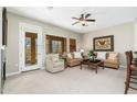 Cozy living room featuring neutral tones, large windows with neighborhood views and balcony access at 20750 N 87Th St # 2074, Scottsdale, AZ 85255