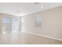Bright living room featuring tile floors, recessed lighting, and sliding glass doors to the outside at 21068 N 58Th St, Phoenix, AZ 85054