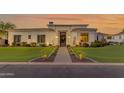 Elegant front exterior with manicured landscaping, modern design, and unique front door at 2742 W Monterey Pl, Chandler, AZ 85224
