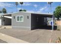 Exterior of home with a covered driveway offers shade and protection from the elements at 5201 W Camelback Rd # A7, Phoenix, AZ 85031
