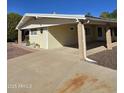 Charming single-story home with a covered carport, low maintenance landscaping, and desert accents by the front door at 523 S Park View Cir, Mesa, AZ 85208
