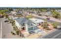 Aerial view of home featuring an attached garage, gated drive, and a second-story balcony at 5338 N 21St Ave, Phoenix, AZ 85015