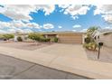 Charming single-story home showcasing a well-maintained front yard and a two car garage at 6217 E El Paso St, Mesa, AZ 85205