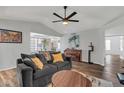 Bright living room showcases modern furnishings, natural light, with dark wood floors and vaulted ceilings at 9396 E Purdue Ave # 220, Scottsdale, AZ 85258