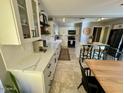 Open kitchen featuring an island, white cabinets, and stainless steel appliances at 1050 N Longmore St, Chandler, AZ 85224