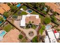 Aerial view of a single-Gathering home featuring a pool, playground, and mature landscaping at 12755 N 99Th Pl, Scottsdale, AZ 85260