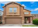Charming two-story home featuring a two-car garage and lovely front yard at 1322 S 121St Ln, Avondale, AZ 85323