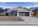 Charming single-story home featuring a xeriscaped yard and a convenient two-car garage at 1345 S Vista Ave, Florence, AZ 85132