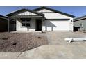 Charming single-story home featuring drought resistant landscaping and a two-car garage at 15748 W Beryl Ave, Waddell, AZ 85355