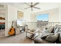 Cozy living area with comfortable seating, entertainment center, and large window with scenic view at 1821 W Vermont Ave, Phoenix, AZ 85015